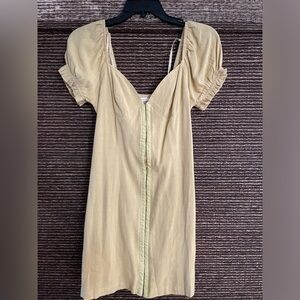 Yellow dress with chips in front